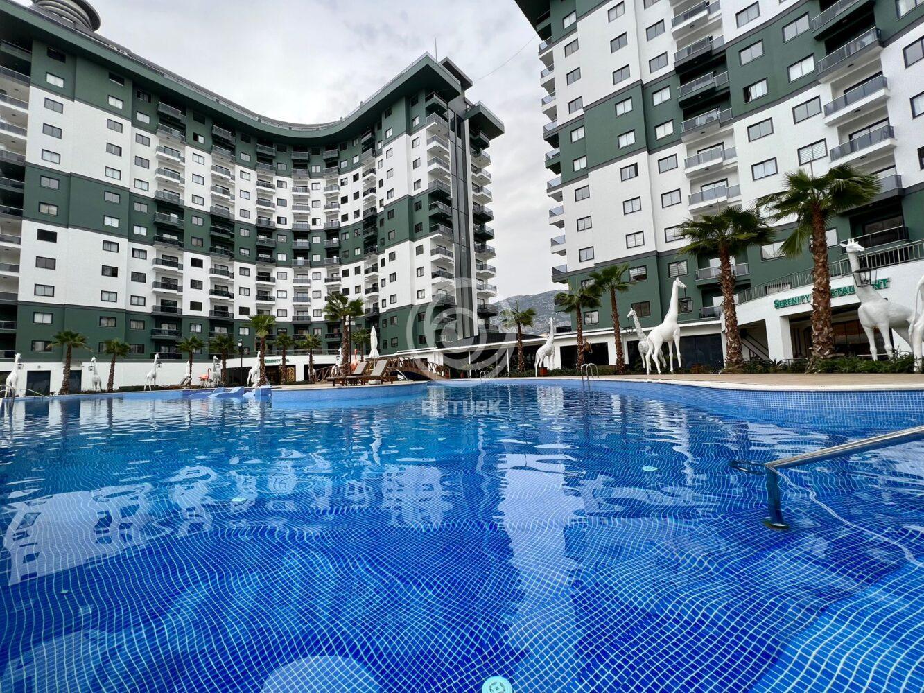Меблированные апартаменты 1+1 в Махмутларе Serenity Residence Alanya