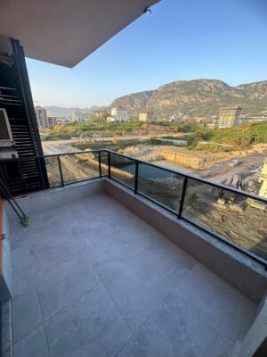 Купить квартиру в Алании: 2+1 в Махмутларе, Guzel 2000