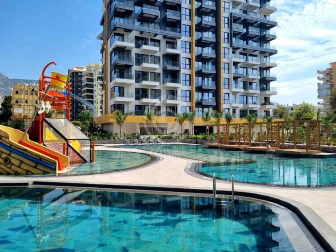 Снижена цена! Квартира 1+1 в CEBECI TOWERS (Махмутлар)